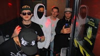 a group of people standing in front of a door